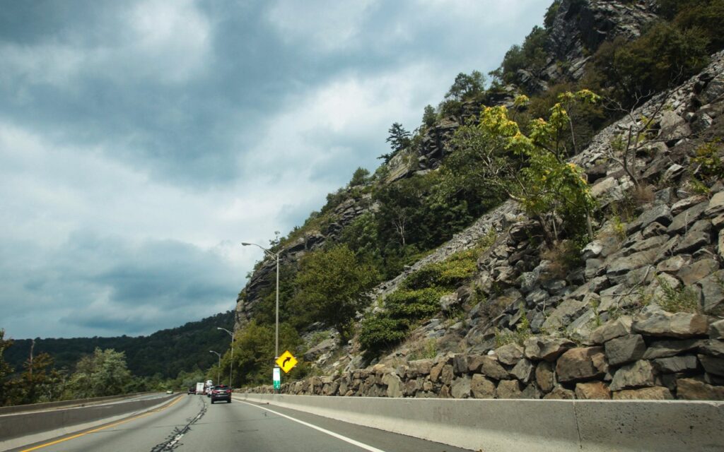 33 I80 Dwg Mp 1 4 Stacked Stone Rockslide Barrier Talus Slope Wb Roadway Eastern End.jpg